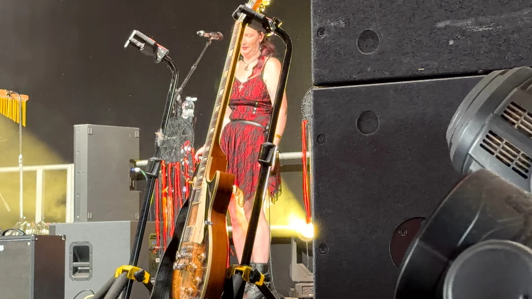 Fleetwood Mad backing vocalist on stage with guitars and festival lighting