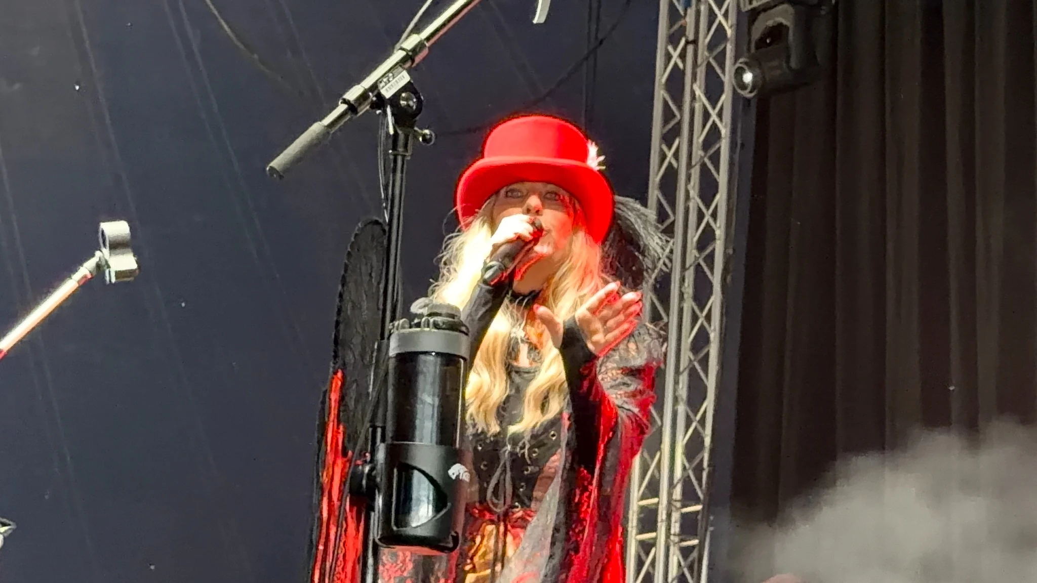 Fleetwood Mad lead vocalist performing in a red top hat at Poole Marina Festival 2026